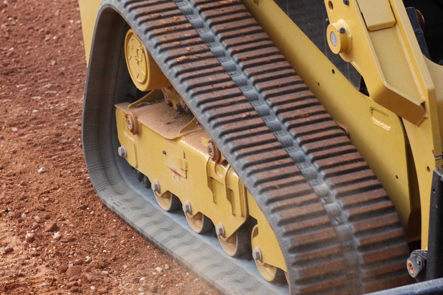 Rental CAT skid machine with all-terrain tracks