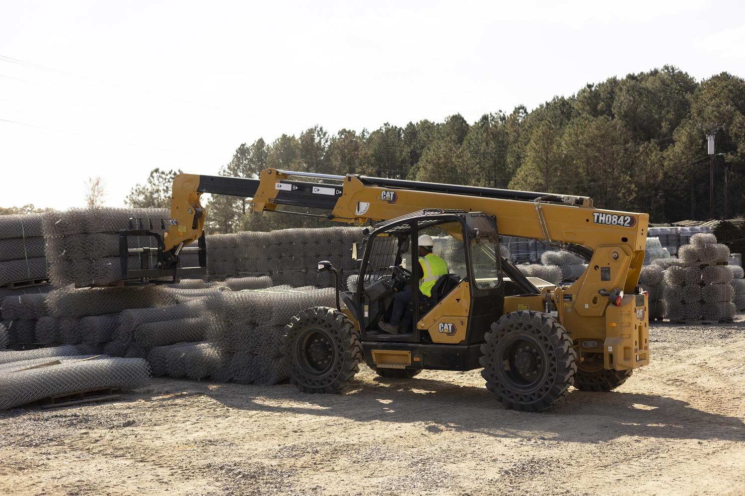 large rented telehandler working on a commercial job site
