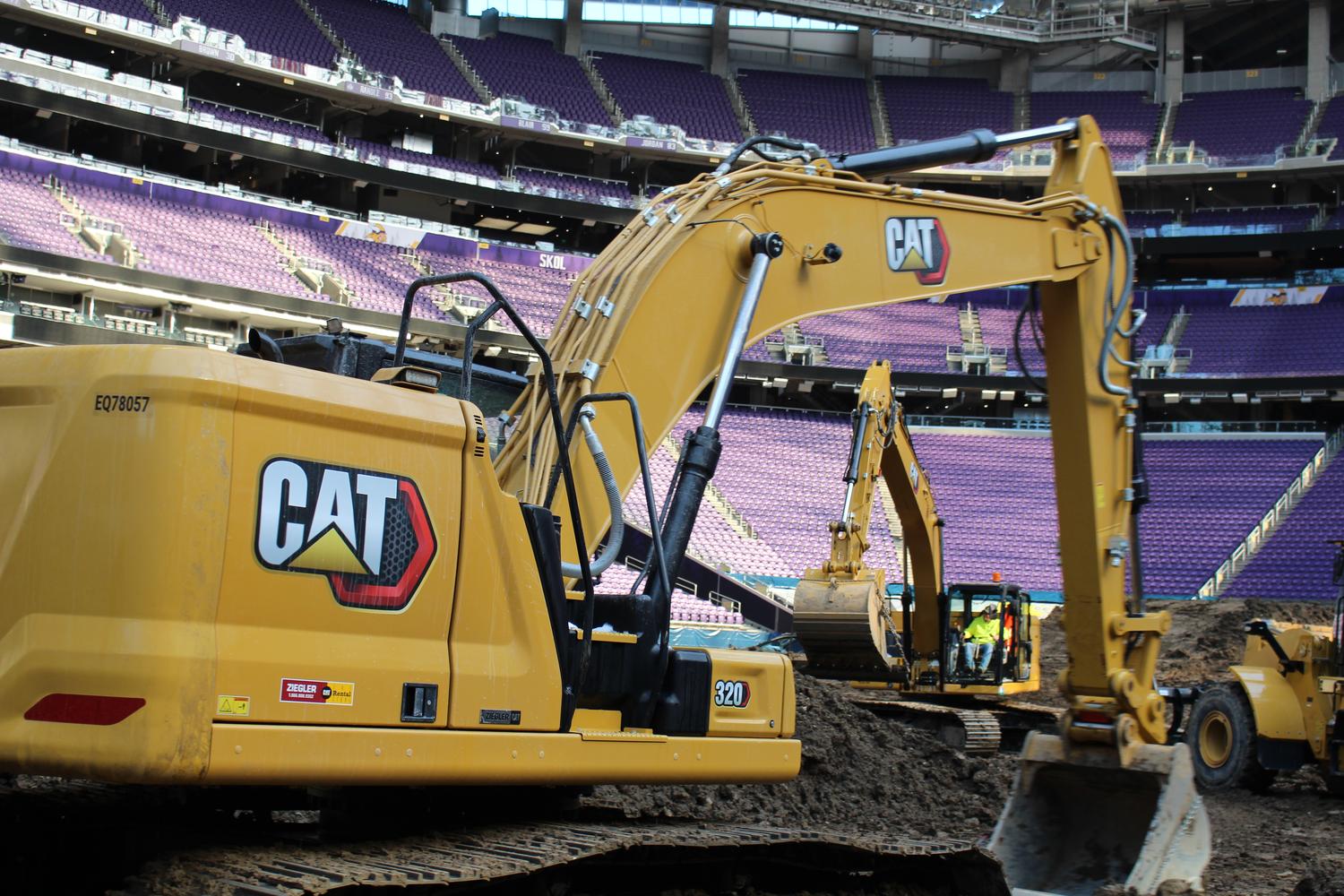 Large CAT excavator working on a commercial job site